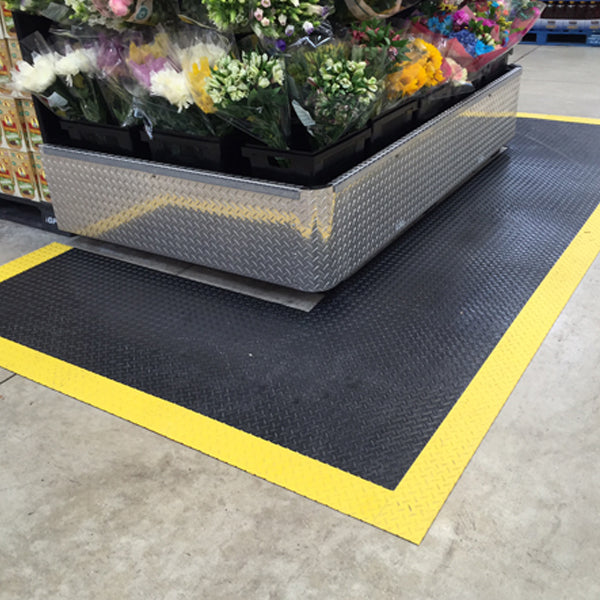 Mat following a floral display base with a yellow perimeter